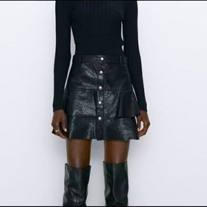 Faux leather mini skirt.